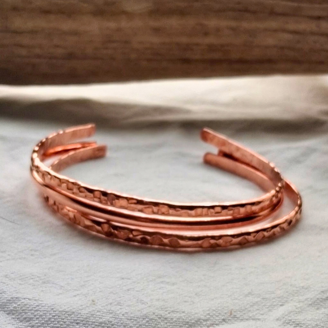 stack of 2 hammered classic cuffs and one classic cuff by cherokee copper 