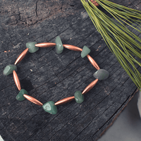 Green stone bracelet with copper accents