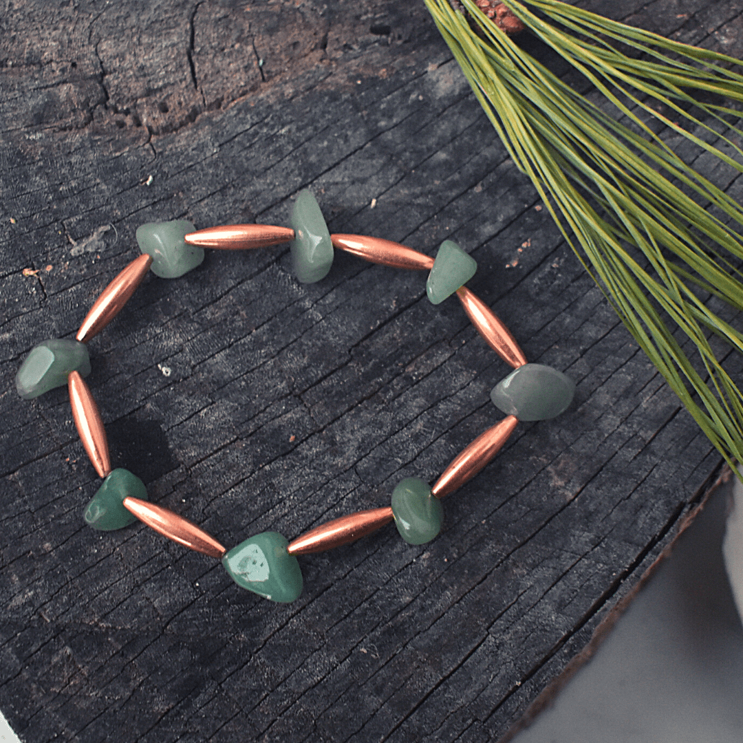 Green stone bracelet with copper accents